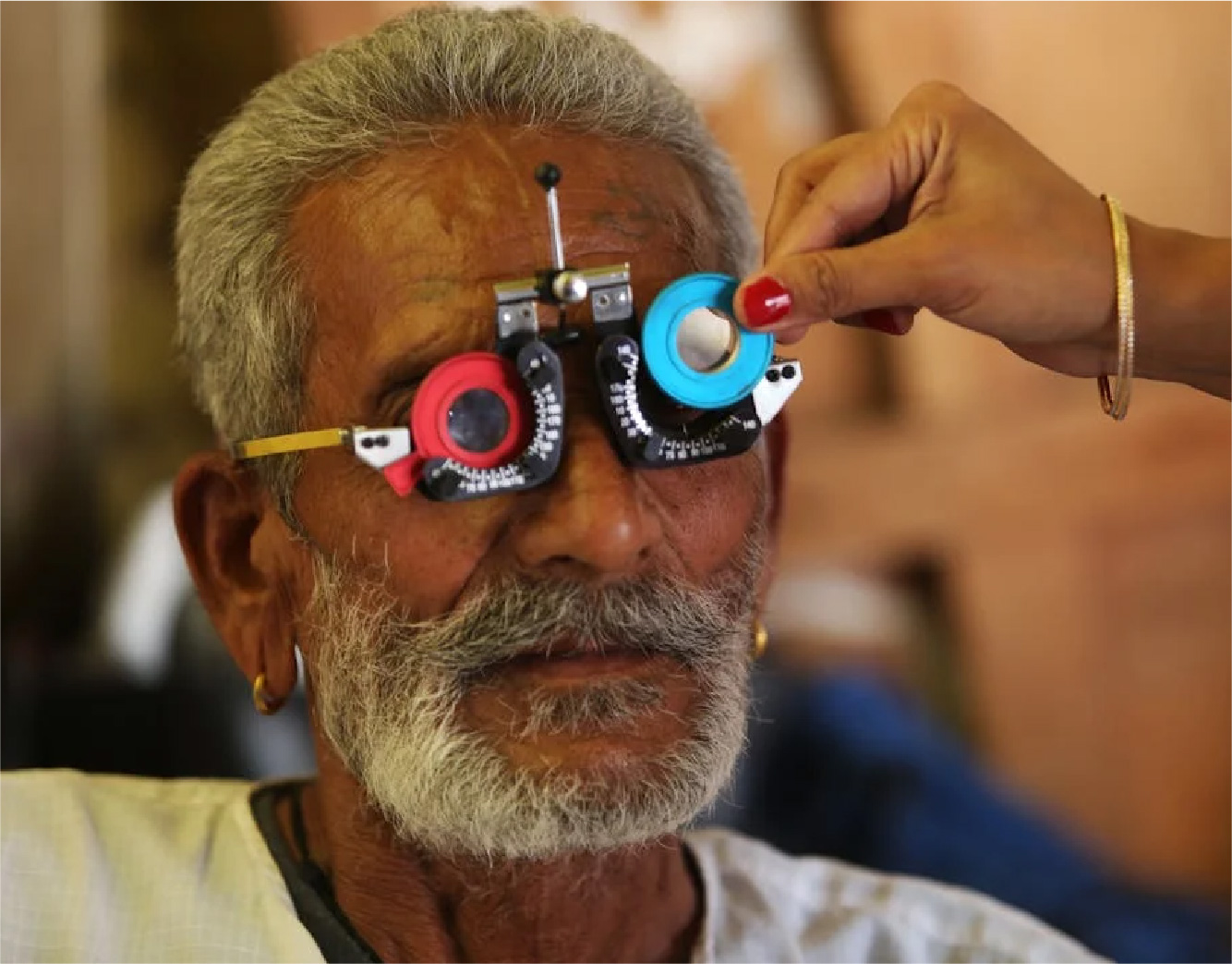 A man having his eyes checked at a cataract surgery clinic